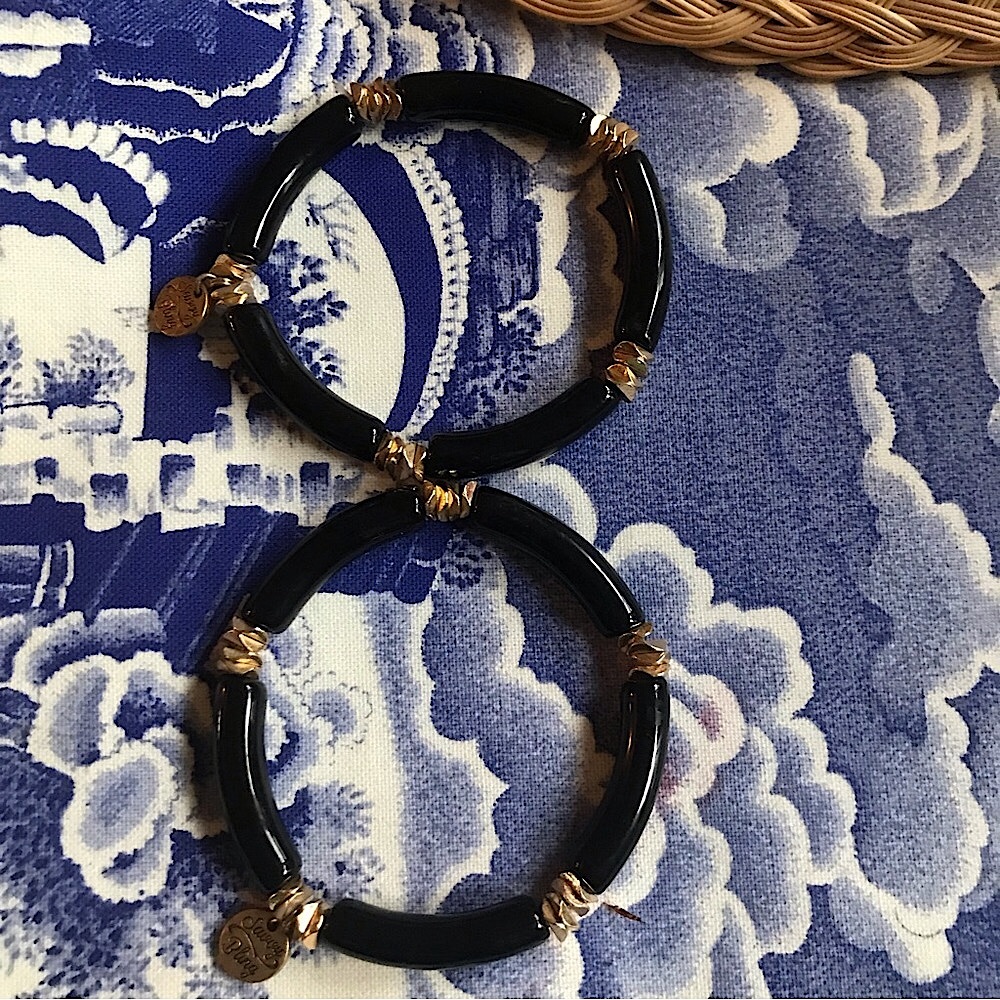 Black and gold stretch bracelets by savory and sweet. Very stylish! Never worn